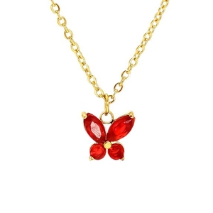Elegant gold chain necklace with a faceted red butterfly pendant on white background