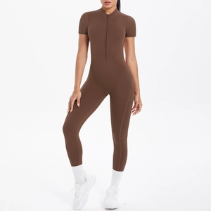 Close-up of deep brown short sleeve sports bodysuit featuring front collar zipper detail