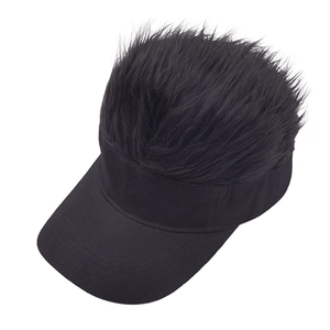Detail view of the black sun visor hat with creative shaggy synthetic hair on top