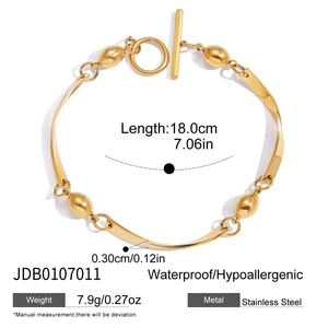 Detail view of 18K gold stainless steel wave bracelet with toggle clasp and measurements