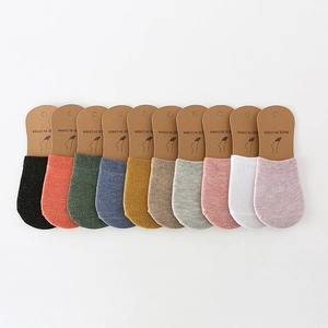 Ten-color set of low-cut cotton invisible boat socks for women on white background