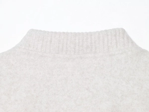 Close-up of the ribbed collar and soft fleece texture on this gray bomber jacket