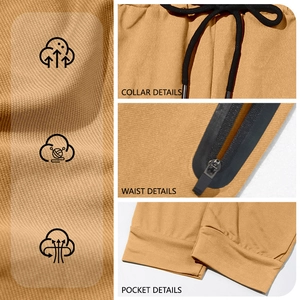 Detail view of khaki joggers featuring elastic drawstring waist and secure zipper pockets