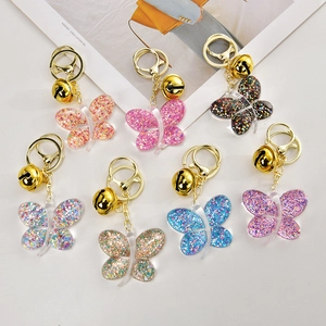 Lot de porte-clés papillon en acrylique coloré avec paillettes et cloches dorées