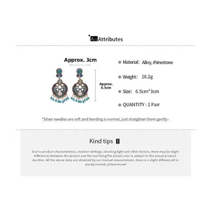 Detailed specs of vintage leaf hollow tassel earrings with turquoise and rhinestones