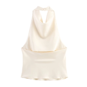 Detail of elegant beige satin halter top showing smooth fabric texture and draped neckline
