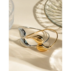 Polished 18k gold and silver stainless steel teardrop open bracelets with artistic light shadows