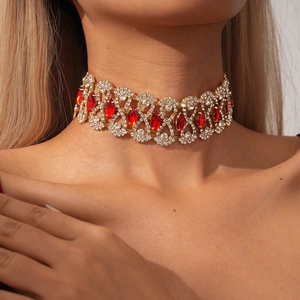 Luxurious gold choker with sparkling diamonds and ruby red marquise gemstones