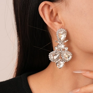 Detailed view of luxury geometric teardrop drop earrings with sparkling crystals