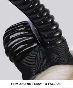Macro shot of black horn headband with spiral texture and secure fabric attachment