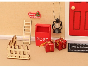 Miniature Christmas dollhouse set with red mailbox, wooden ladder, and gift boxes