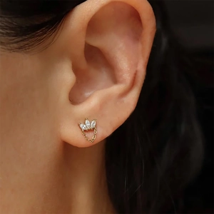 Detail of S925 silver crown stud earring with marquise zirconia and chain tassel