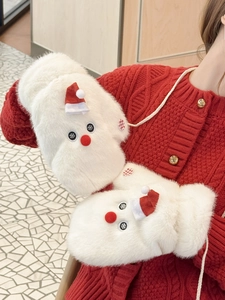 Detail of plush snowman mittens with red mini hat and hanging neck string for outdoor use