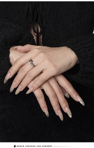 Detail of S925 silver Z-shape ring featuring black spinel stones on a textured band