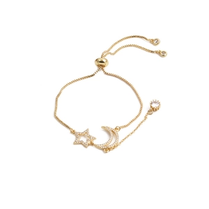 Detail of gold star and moon bracelet with zircon pavé and adjustable slide clasp
