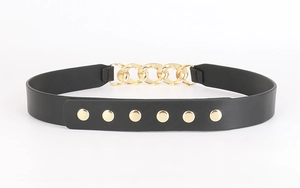 Close-up of black PU leather corset belt with gold metal chain and rivet buckle details