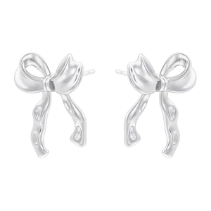 Macro detail of silver-finish bow-shaped stud earrings with polished metallic texture