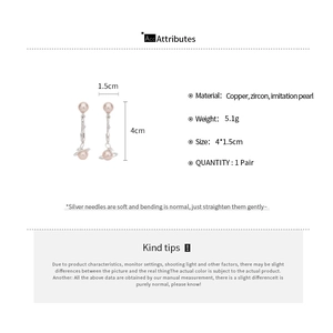 Vue détaillée des dimensions des boucles d'oreilles Saturne en perles et zircons