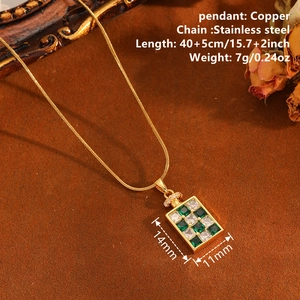Retro checkered square pendant necklace with green and white diamonds on a gold chain