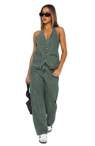 Detail of green denim halter vest featuring V-neck buttons and wide-leg matching pants