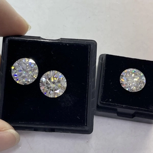 Macro view of D-color round brilliant cut moissanite stones showing intense fire and sparkle