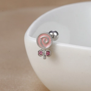 Close-up of lollipop stud earrings with pink enamel and sparkling zircon stones