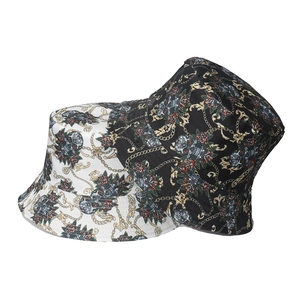Punk style bucket hat with skull, rose, and chain print in black and white options