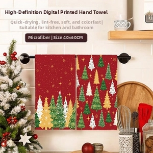 Detail of Christmas microfiber hand towels 40x60cm with festive tree print on towel rack