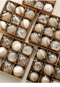 Detail of assorted 8cm Christmas ball ornaments with lace and glitter in a kraft gift box