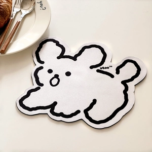 Close-up of minimalist cartoon bear desk mat with non-slip texture and wavy edges