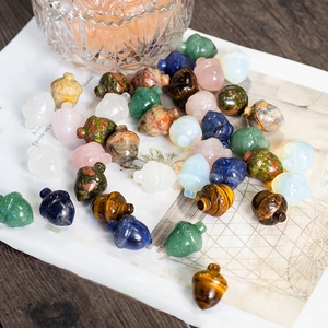 Mixed crystal acorn pendants in various gemstones like tiger eye and rose quartz