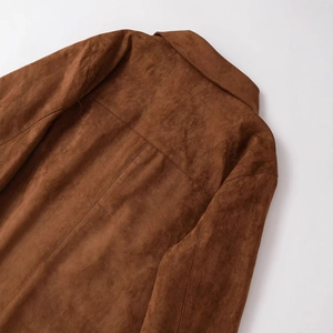 Back view of a brown suede cropped jacket with a zipper and turn-down collar detail