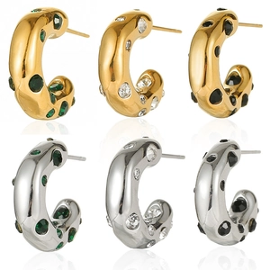French style 14K gold and silver chunky C-hoops with emerald, diamond, and onyx stones