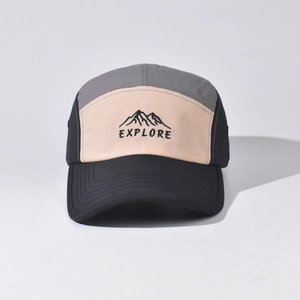 Close-up of high-quality mountain embroidery and EXPLORE text on a camper hat