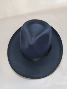 Vertical top view of a classic navy wool fedora hat with a black ribbon band detail