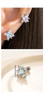 Macro detail of cross flower stud earrings with zircon stones and dimensions 0.84cm