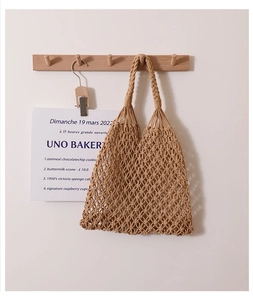 Detailed view of khaki cotton rope hand-woven bag with minimalist hollow pattern