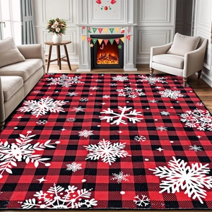 Close-up of red and black plaid Christmas rug with snowflake patterns in a living room