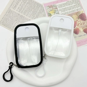 Portable macaron color spray bottles with silicone cases and hooks on a display tray