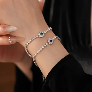Elegant floral tennis bracelet with sparkling zircon and green or blue gemstones