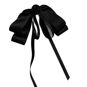 Elegant black satin bow hair clip featuring a delicate 3D rose flower ornament