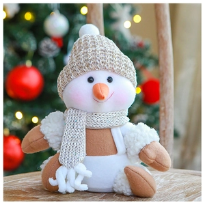 Detailed shot of a plush Christmas snowman doll featuring a beige knit hat and cozy scarf
