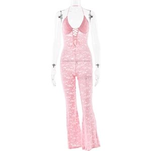 Detail of pink lace jumpsuit featuring a halter neck and bell-bottom legs on mannequin