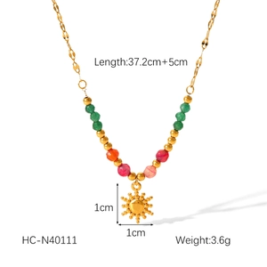 Detail of beaded necklace showing dimensions 37.2+5cm and 1x1cm golden sun pendant