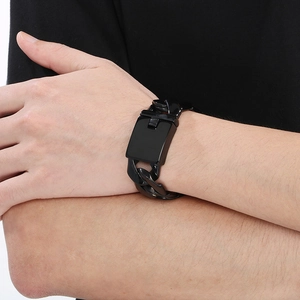 Detailed view of a sleek 24mm black Cuban link bracelet with a polished metal clasp