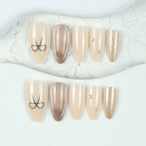 Elegant 10pcs set of almond press-on nails with 3D silver bows and glitter details