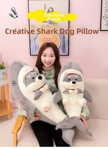 Detailed comparison of shark dog plush pillows in large and medium sizes on a pink background