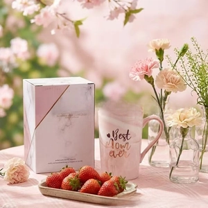 Detail of pink marble ceramic mug with gold Best Mom Ever lettering and gift box