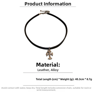Detail view showing black leather choker length of 40.3cm with vintage alloy cross pendant
