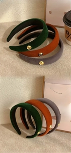 Three-piece set of thick velvet headbands in green, brown and purple with gold details